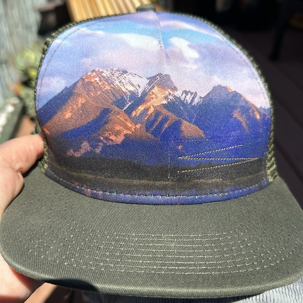 Ron Som trucker skater hat. Army green w mountain and sky picture on front. EUC
